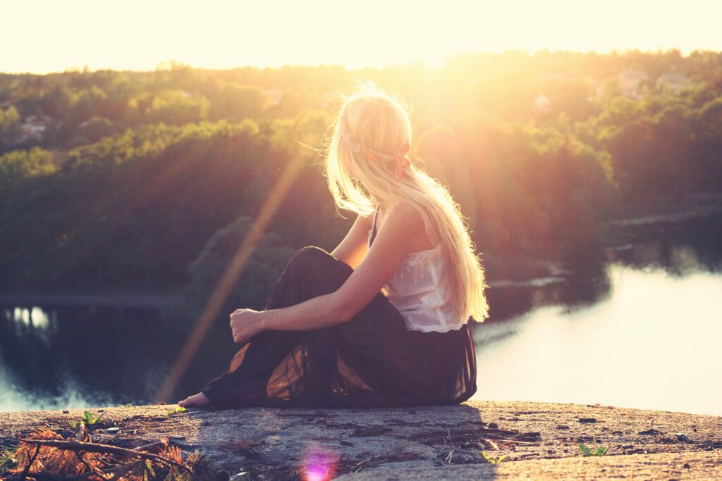 Woman looking to sunset