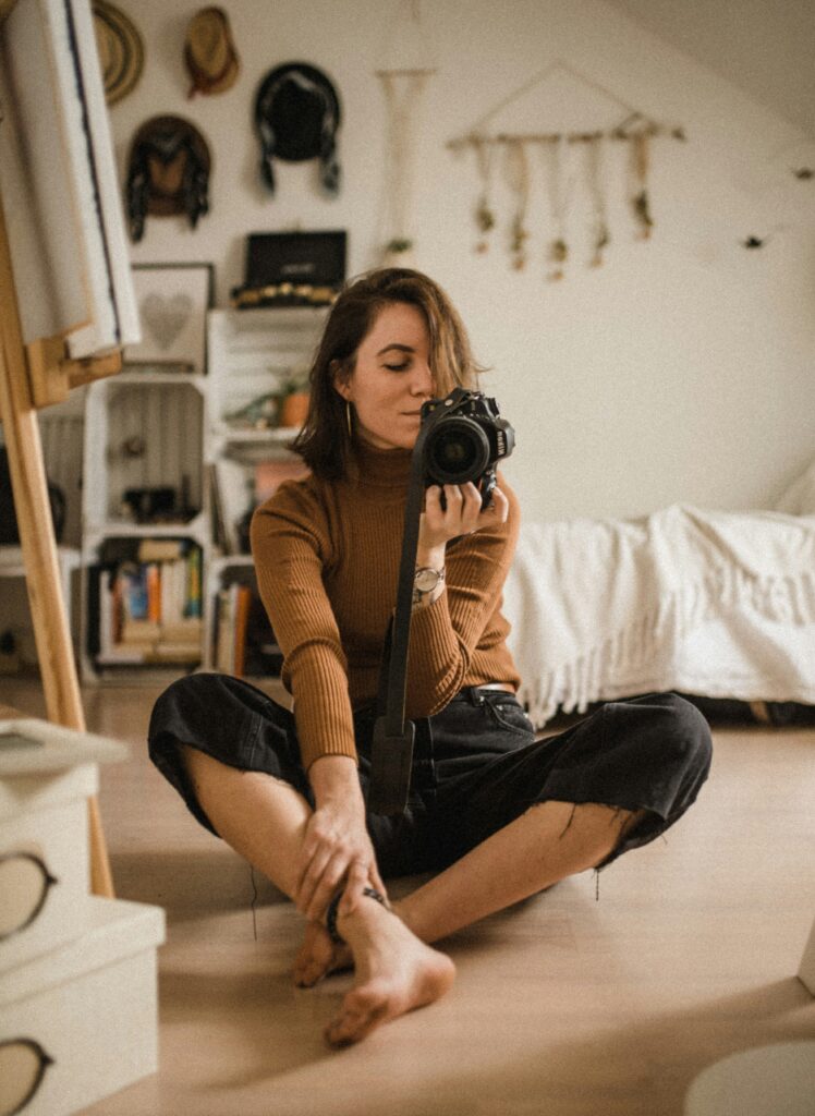 woman making photo of herself in mirror