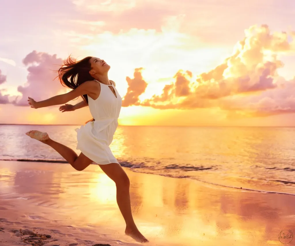 women jumping in the sunset