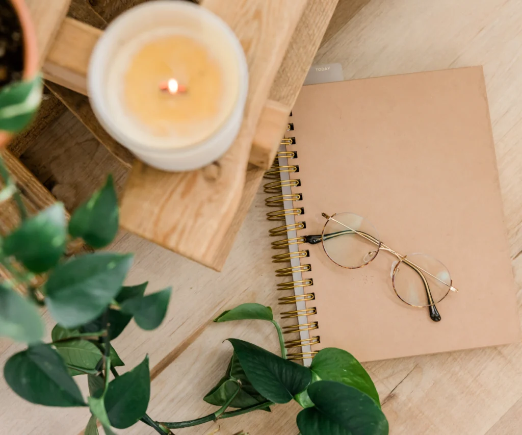 notebook and candles on the table